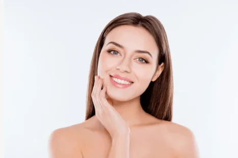 Woman smiling with smooth skin after a Radiesse skin tightening treatment at Bare Skin Marin in Kentfield, CA.